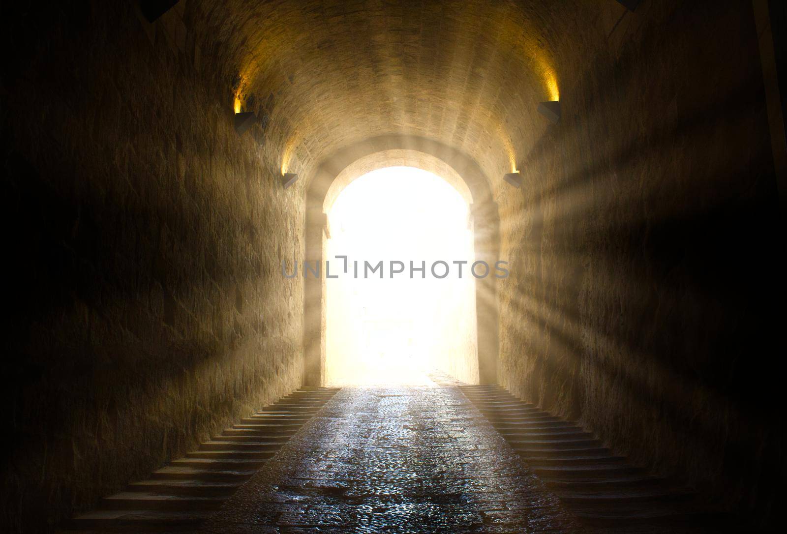 A bright yellow glowing light breaking through at the end of a dark tunnel by tennesseewitney