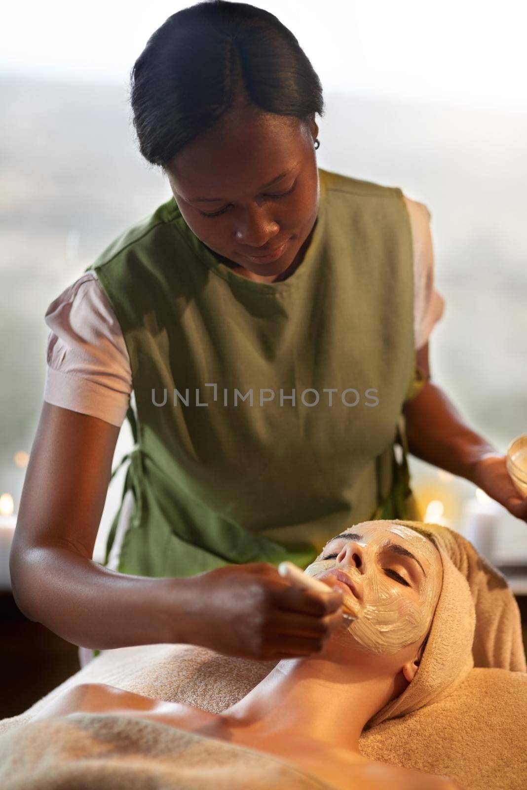 Shot of a young woman receiving a beauty treatment in a spa.