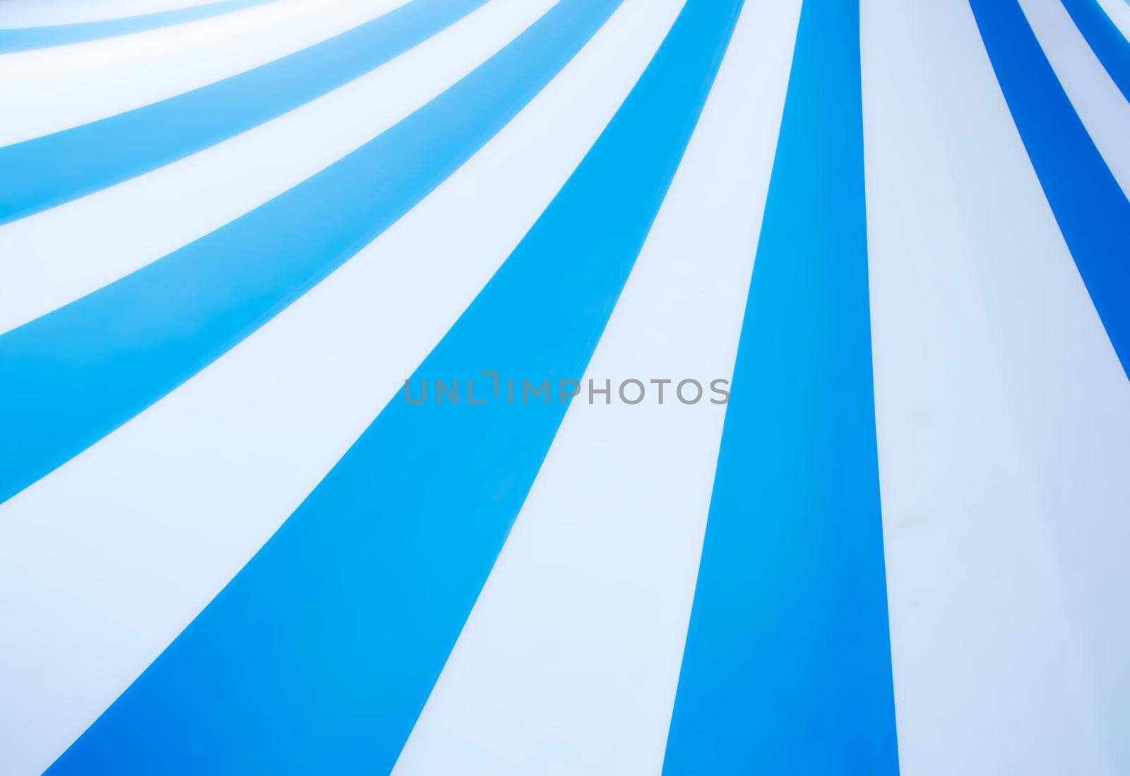 Abstract vintage pop art background design with thick blue and white stripes with copyspace for text by tennesseewitney