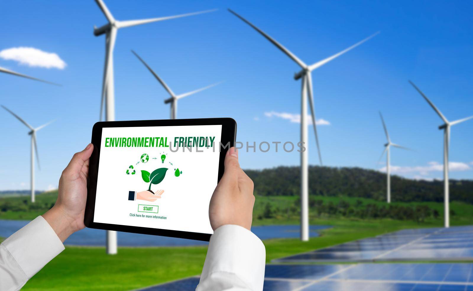 Green business transformation for environment saving and ESG business concept. Businessman using tablet to set corporate goal toward environmental friendly management and alternative clean energy use.
