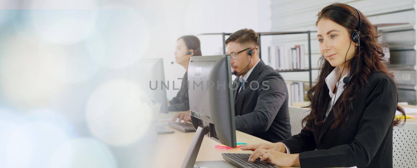 Business people wearing headset working in office broaden view by biancoblue