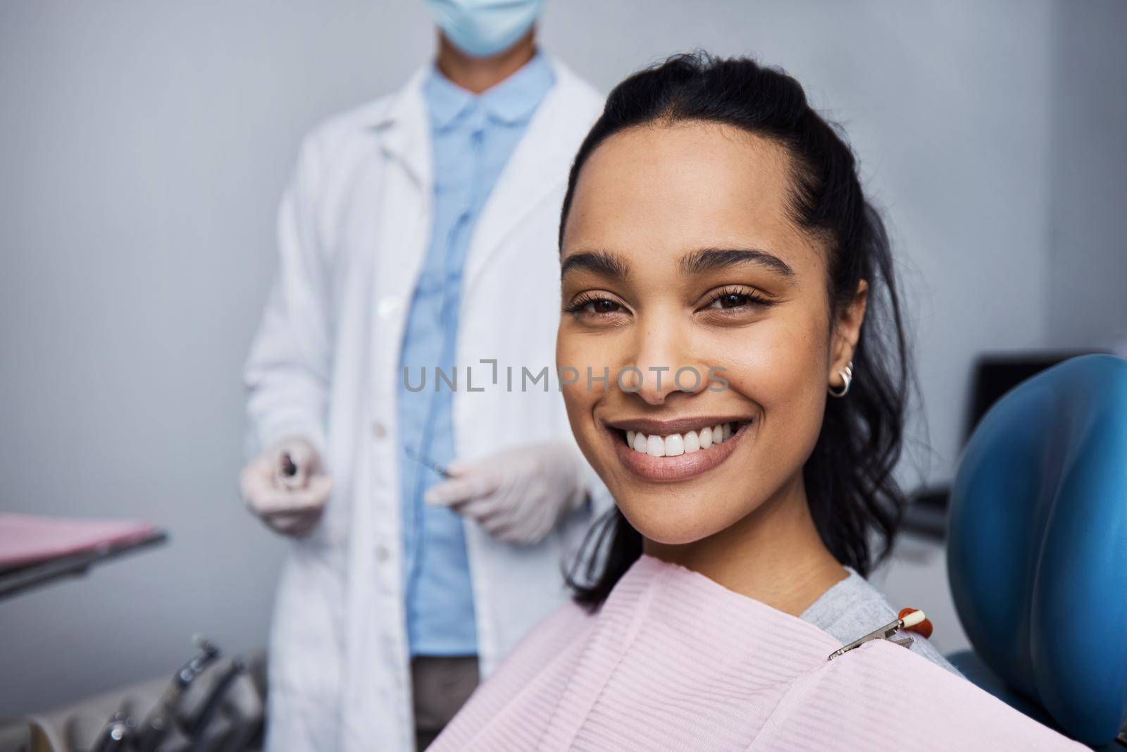 Portrait of a young woman having dental work done on her teeth.
