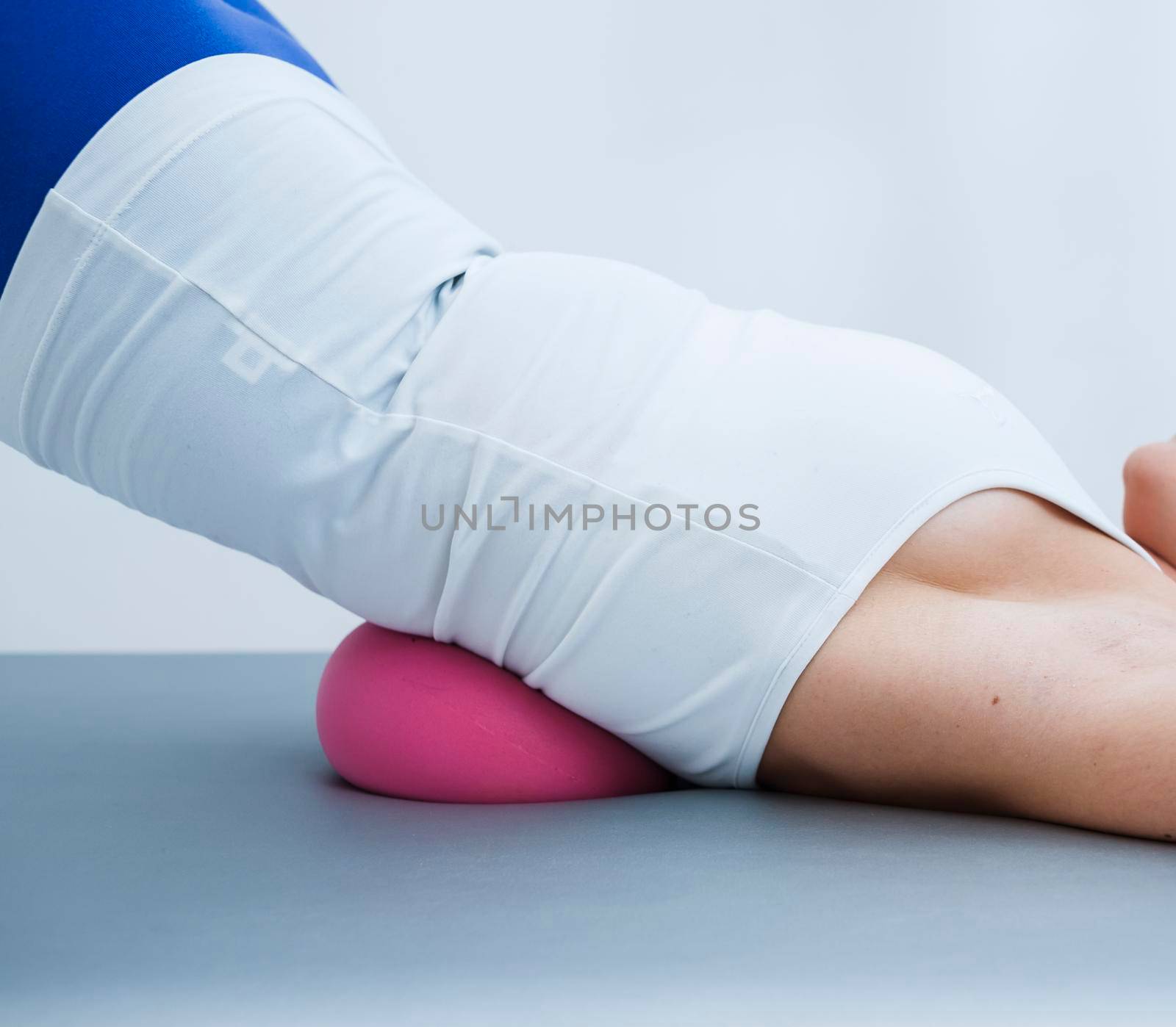 Woman during pilates exercises for the back.