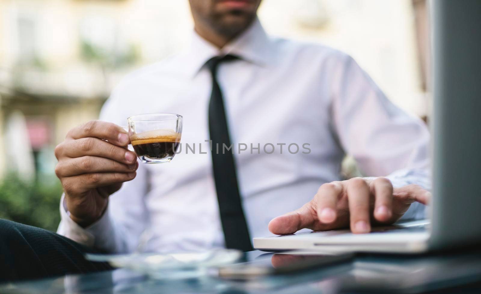 Businessman working at cafe in the city