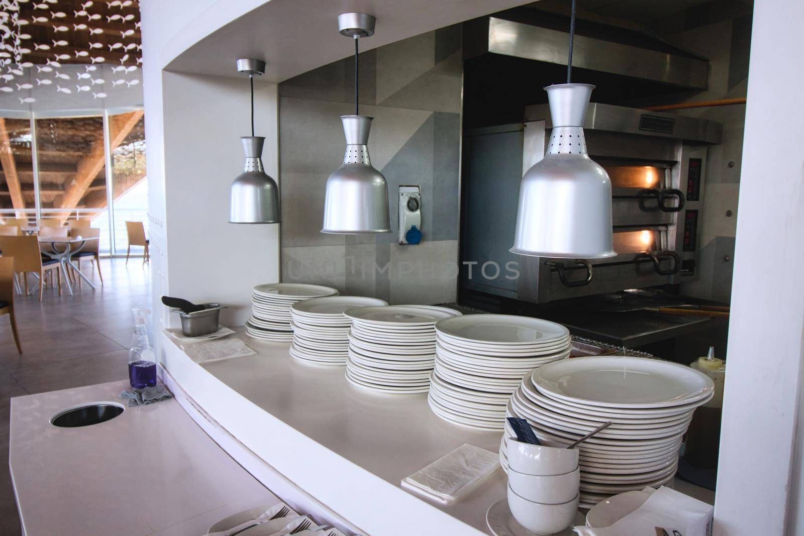 Kitchen serving hatch in a modern design restaurant by tennesseewitney