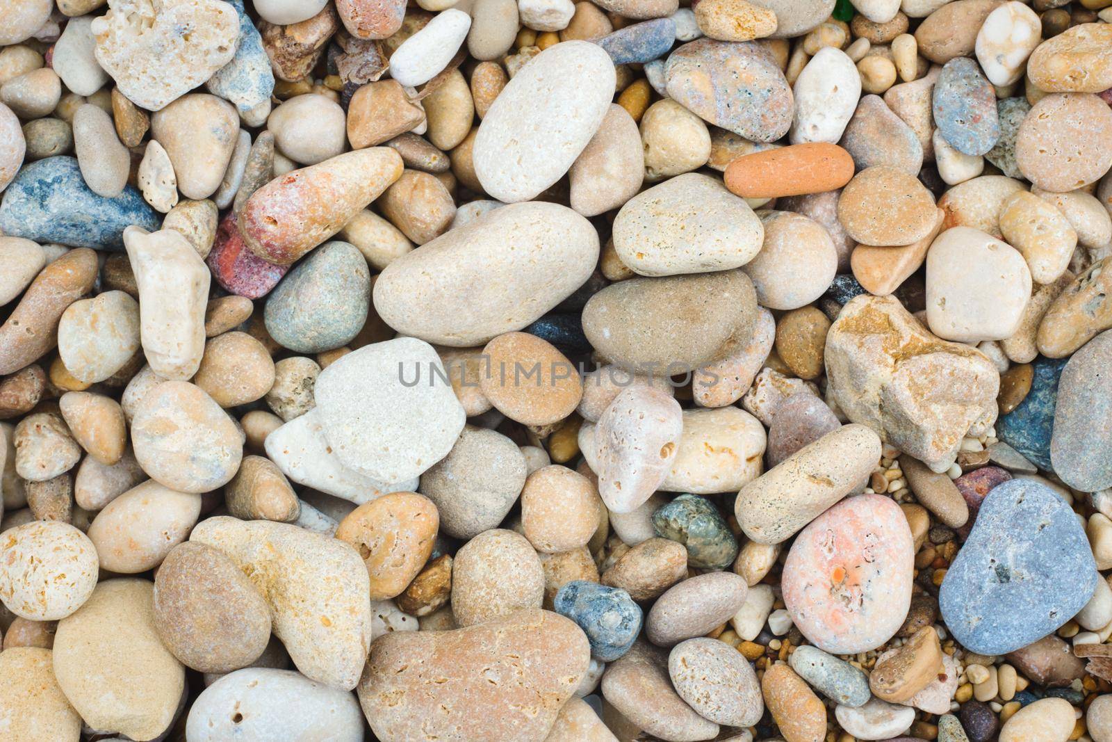 Colorful pebbles on the beach by tennesseewitney