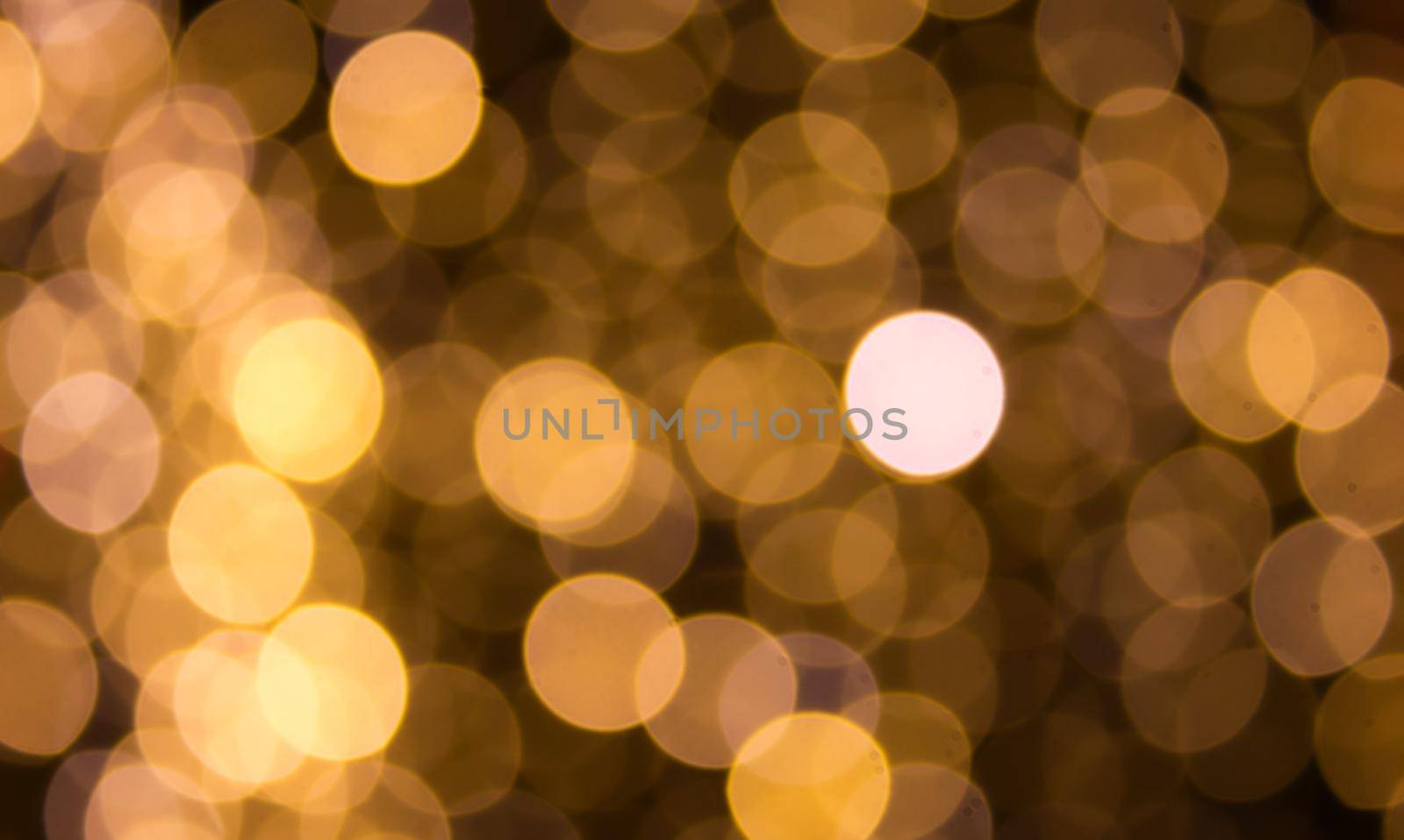 Background with defocused yellow lights with bokeh effect