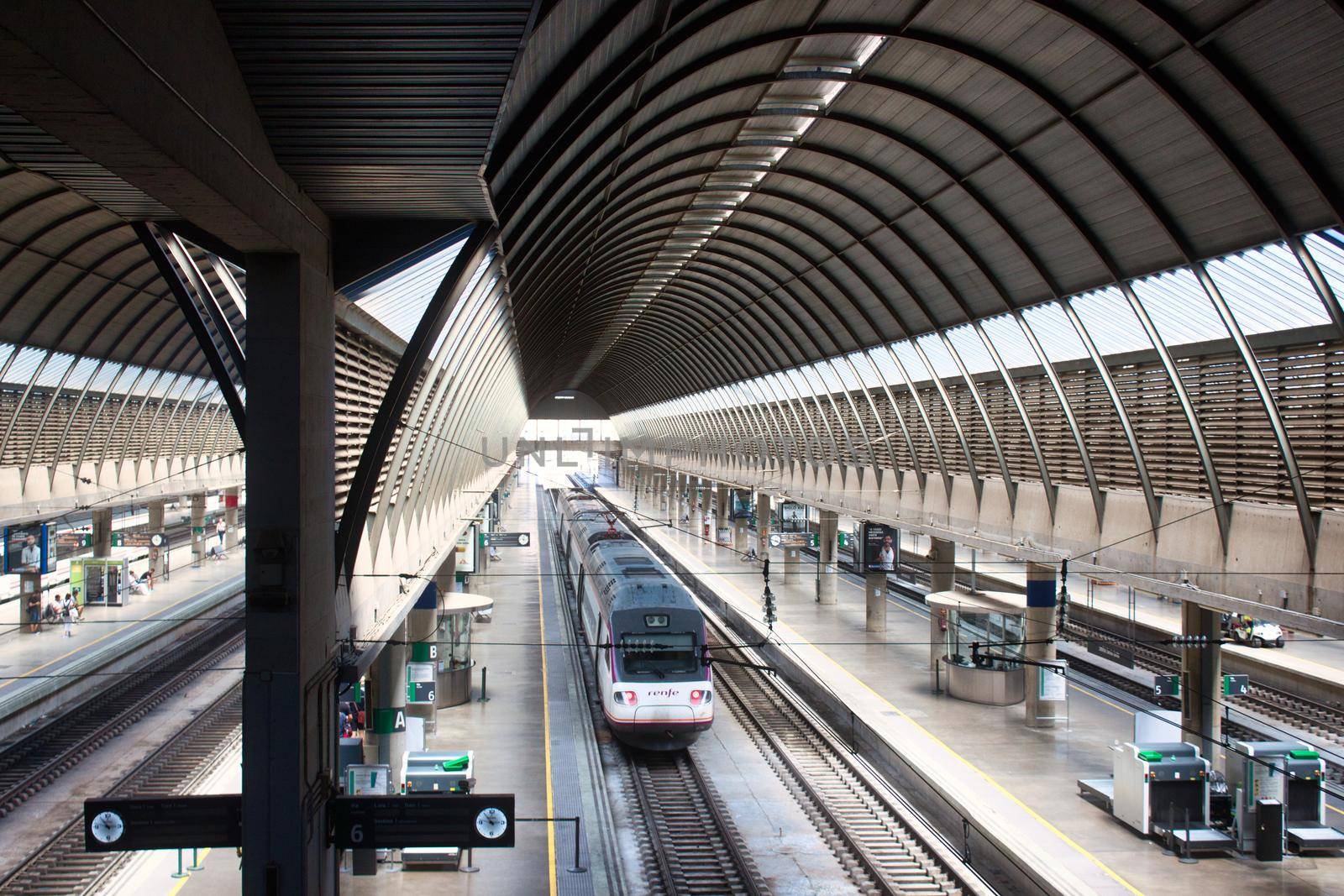 Seville / Spain - August 22 2019: High angle view of a train in a modern train station indoors