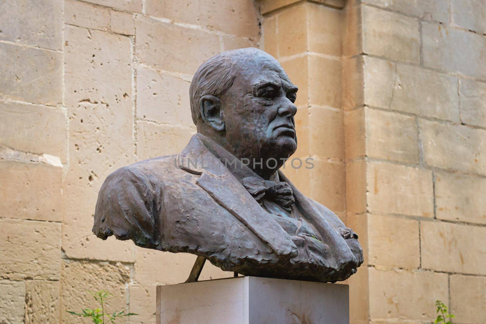 Metal bust of Winston Churchill set on a marble plinth