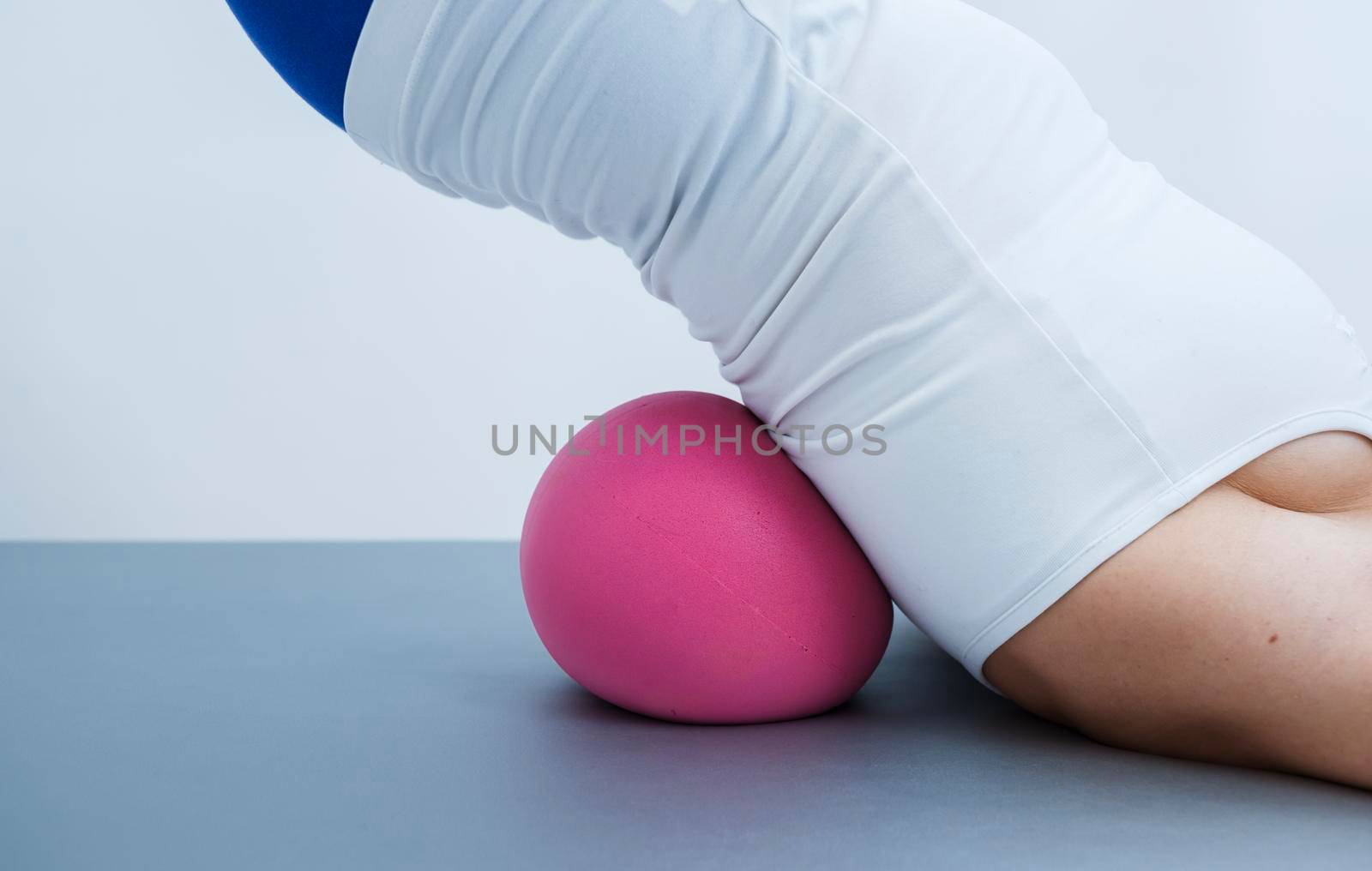 Woman during pilates exercises for the back by SimmiSimons