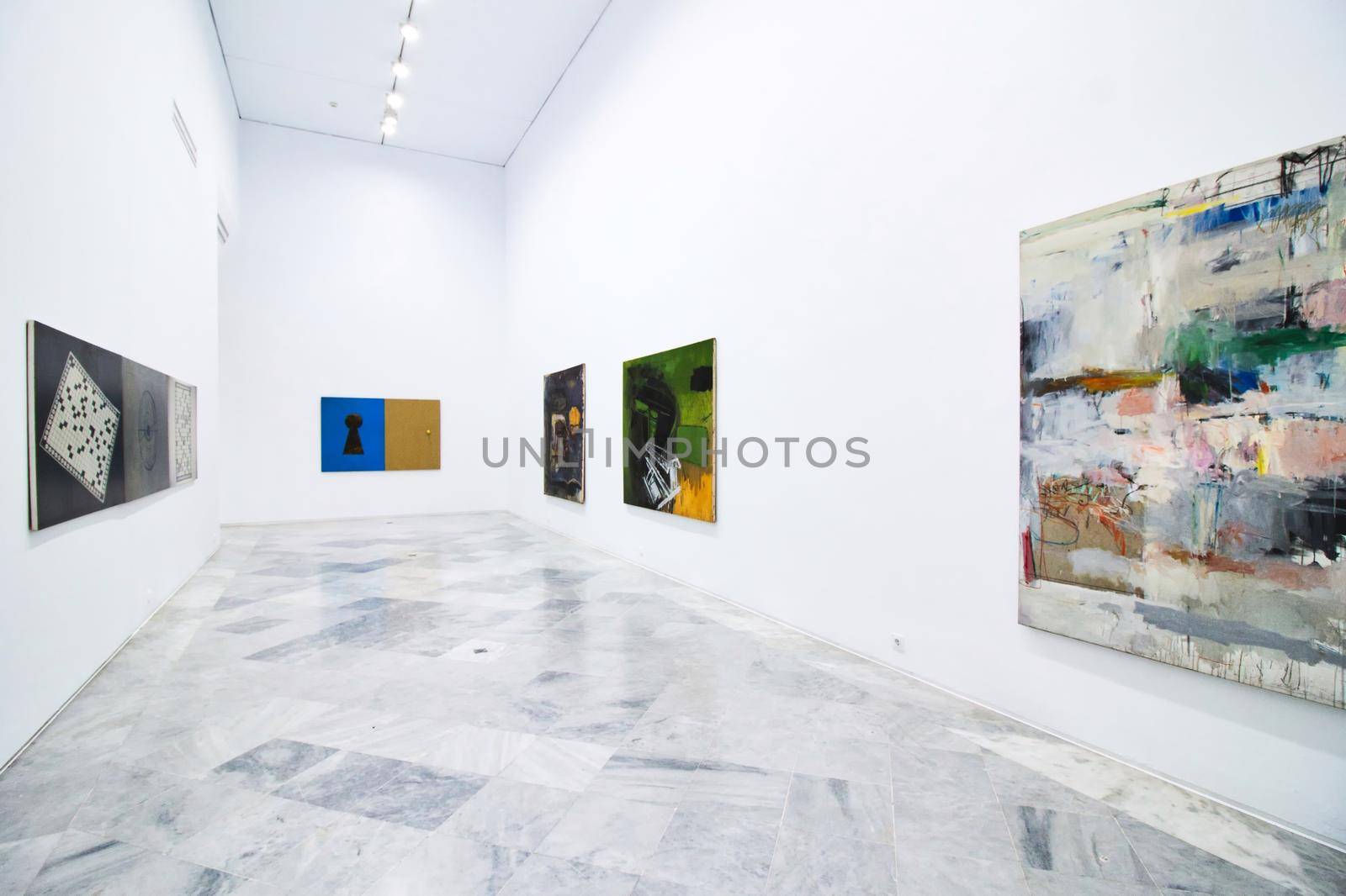 25 Jan 2022 - Seville, Spain: Room in a modern art gallery with large paintings on the walls