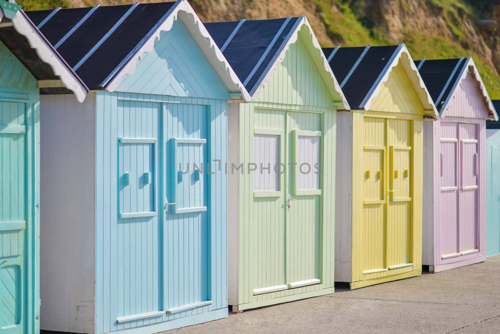 Colored wooden houses on the ocean coast bathing cabins at Saint aubin sur mer