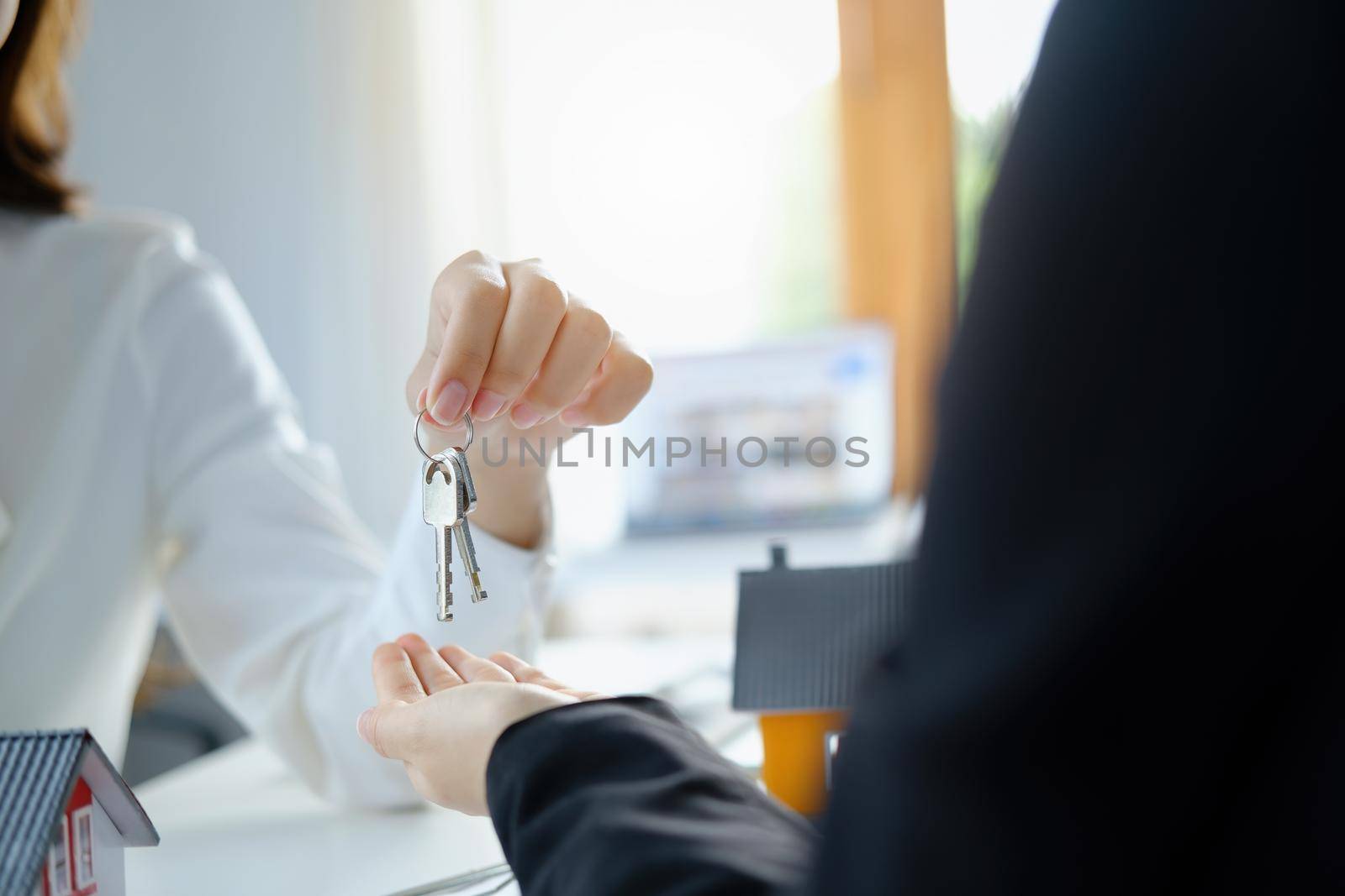 Guarantee, mortgage, agreement, contract, sign, real estate agent delivers the keys to the customer after signing important contract documents.