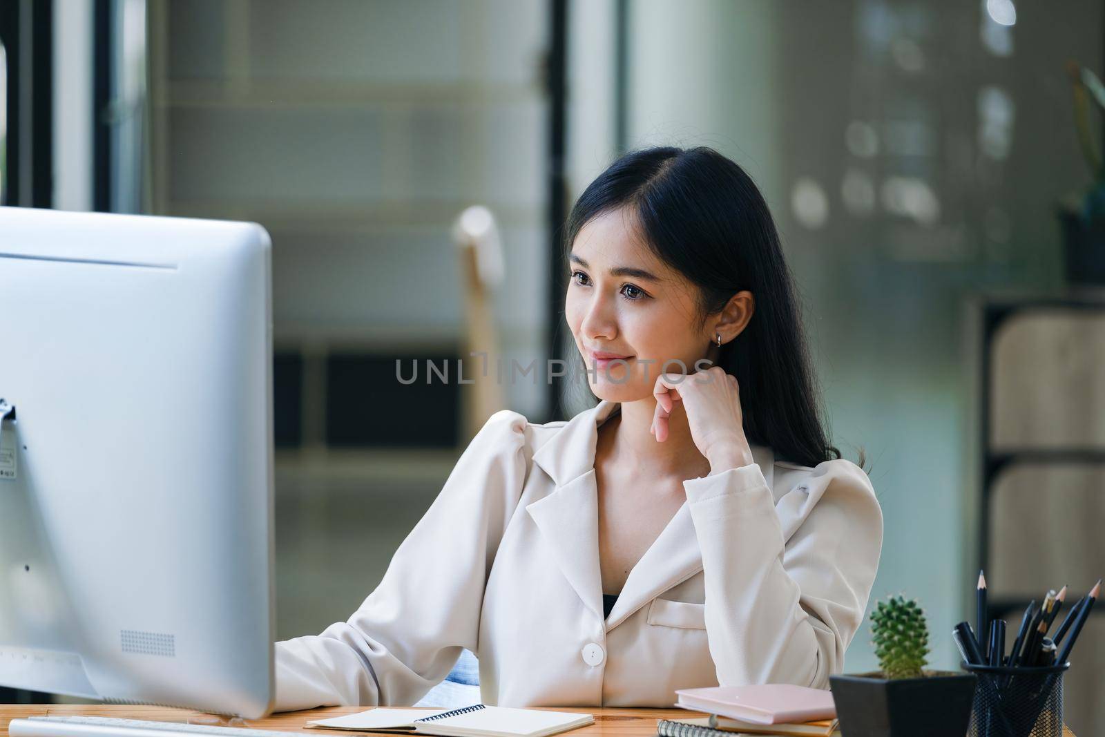 data analysis, budget calculation, research, risk management, portrait of Asian women using computers and financial documents in capital planning to increase company profits.