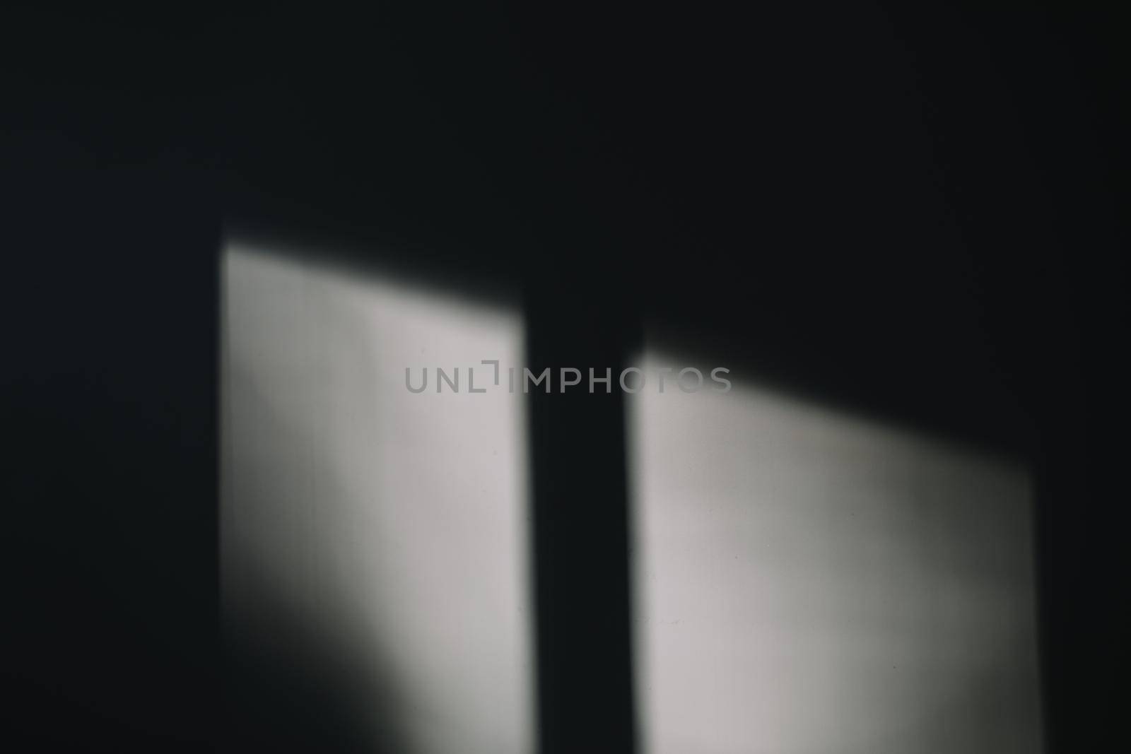 Abstract shadow and lights on white wall from window, monochrome, black and white Abstract shadow on the wall