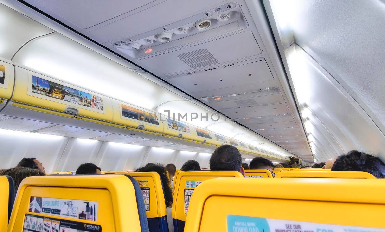 London, UK - August 28 2019: Interior of a Ryanair passenger plane full of people by tennesseewitney