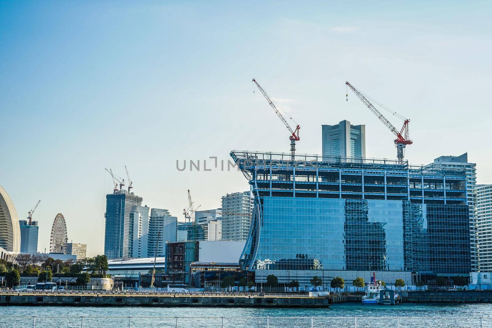 Construction crane and the city of Yokohama Minato Mirai. Shooting Location: Yokohama-city kanagawa prefecture