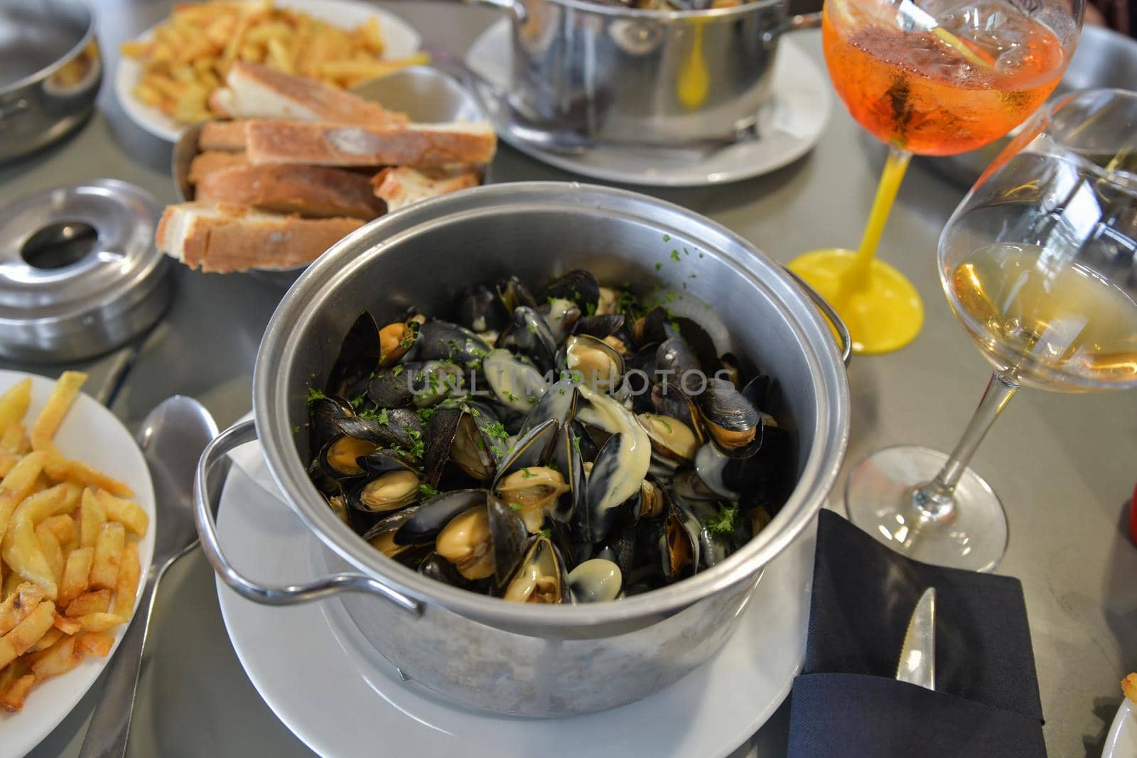 Mussels with french fries and beer in a french restaurant