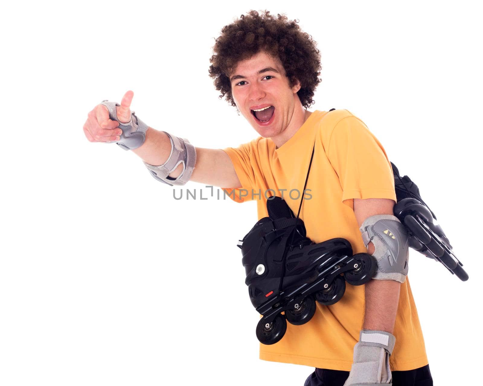 Active roller boy with roller skates over his shoulder showing ok sign. Isolated on white.