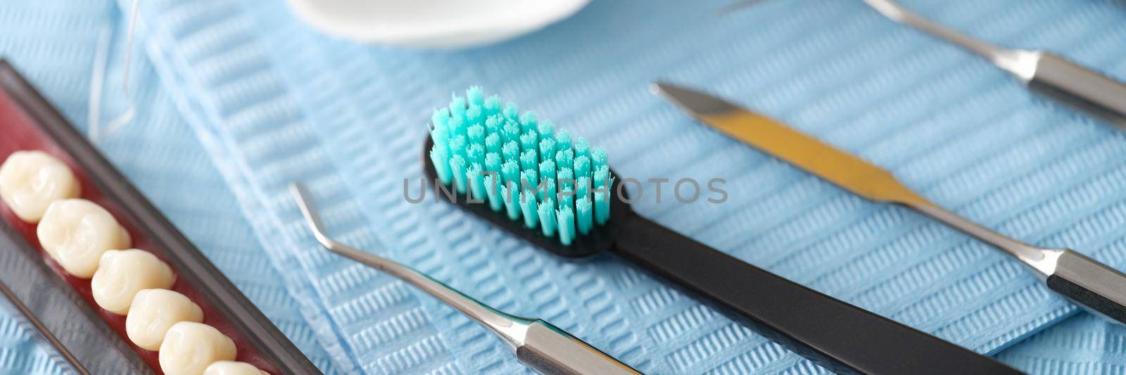Dental instrument dental floss and dental implants closeup by kuprevich