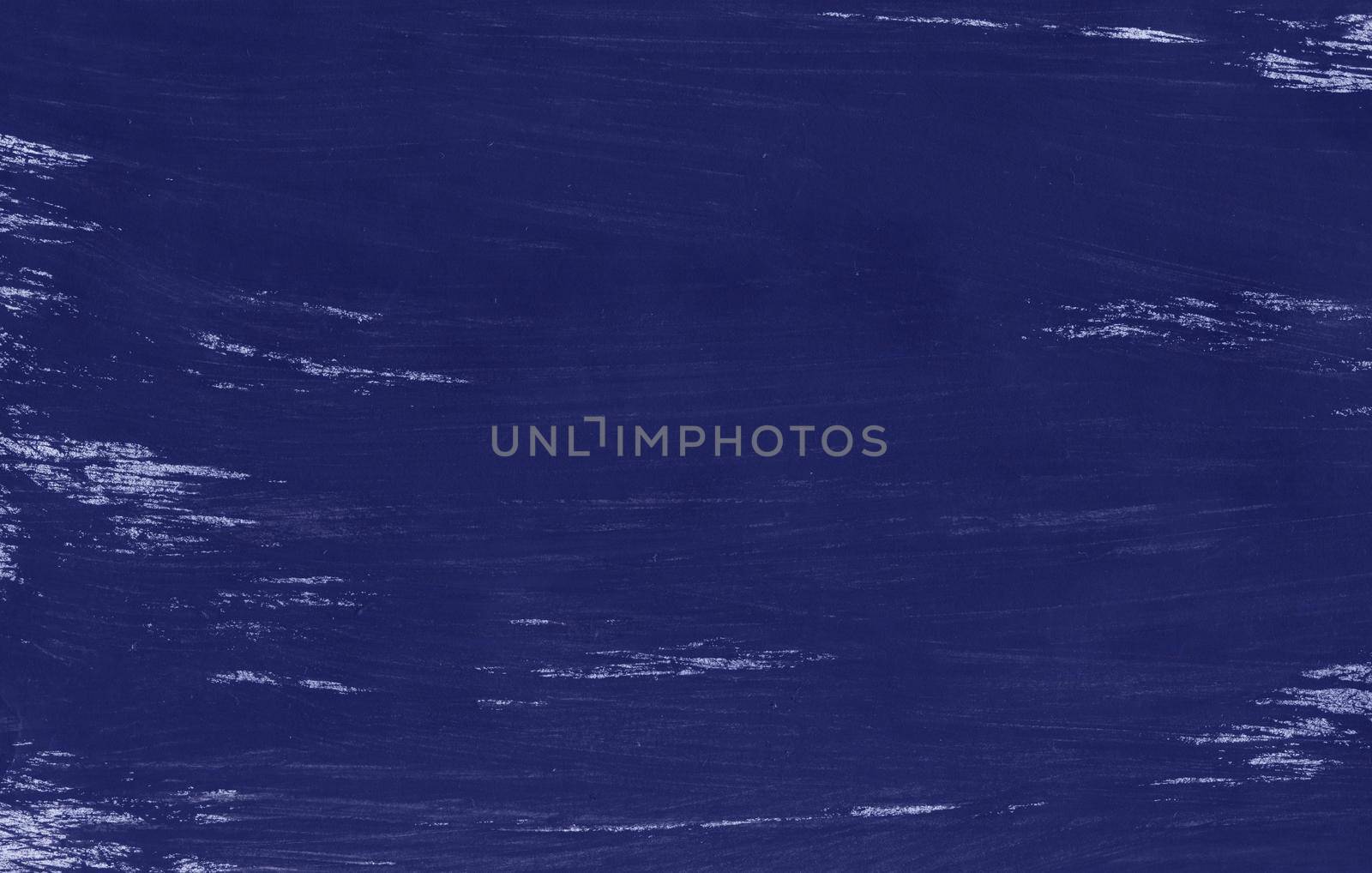 A painted sheet of blue color with a gouache brush. Hand-drawn gouache blue abstract background. Texture of brush strokes.