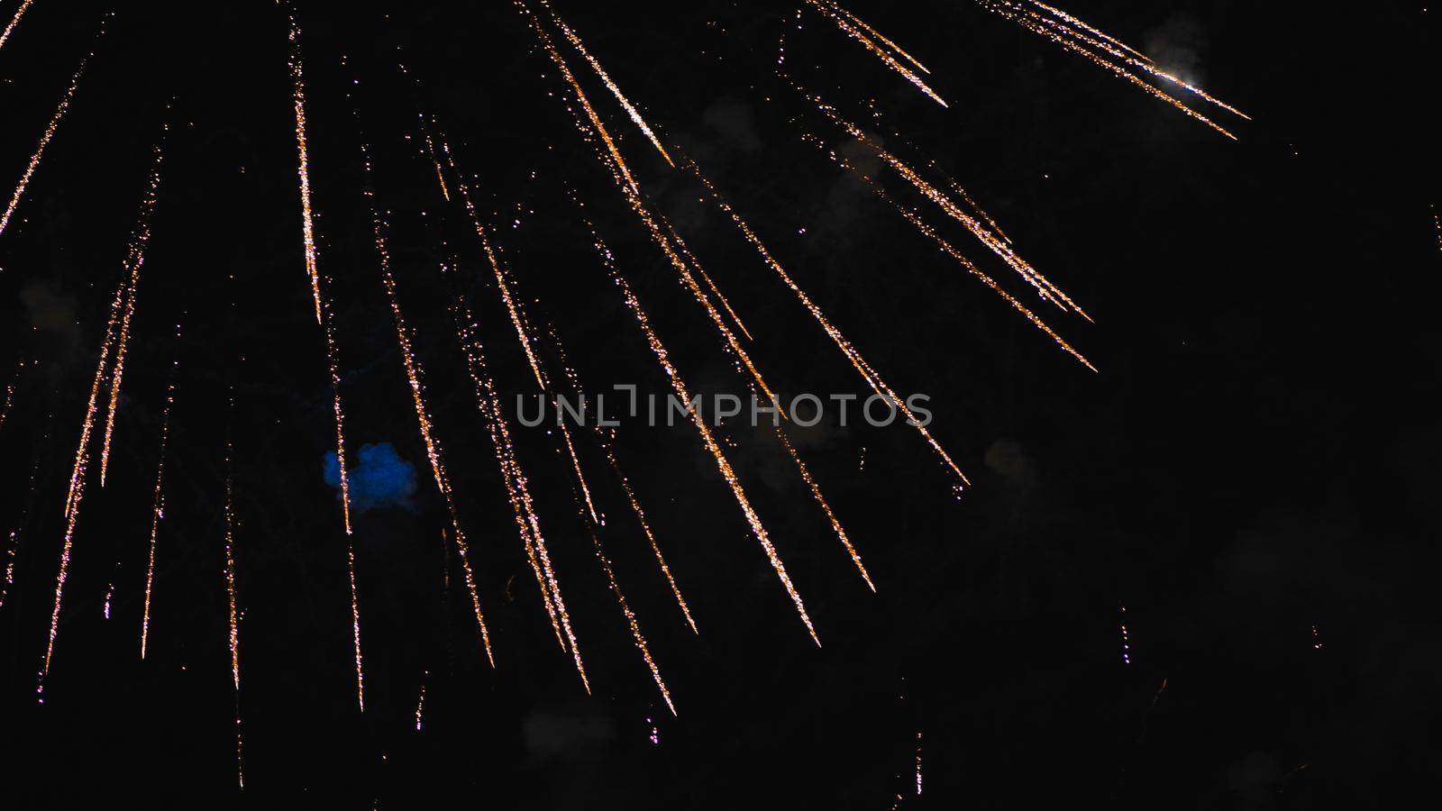 Elements of an explosion of fireworks in the night sky