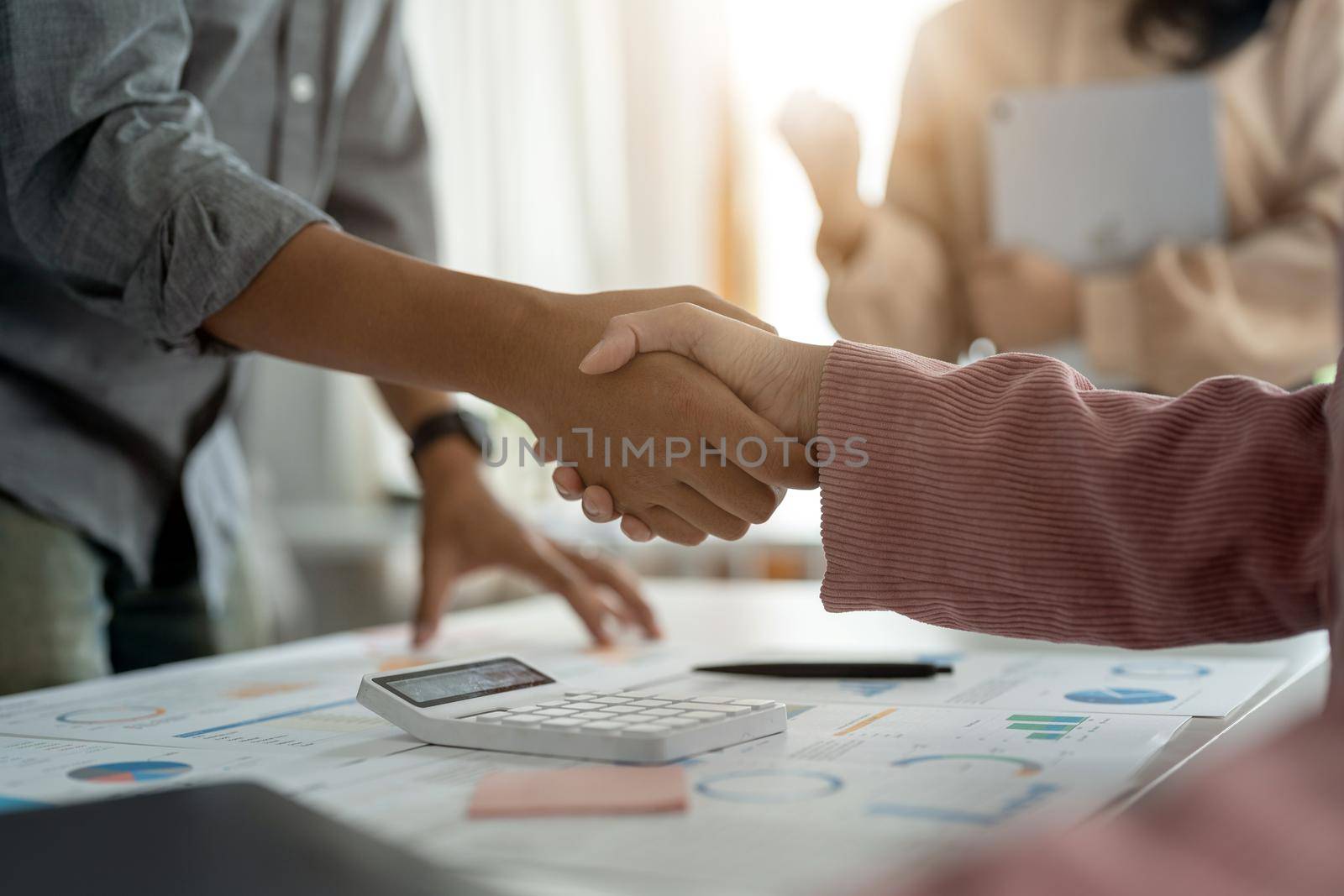 Business people shaking hands, finishing up meeting, business etiquette, congratulation, merger and acquisition concept.