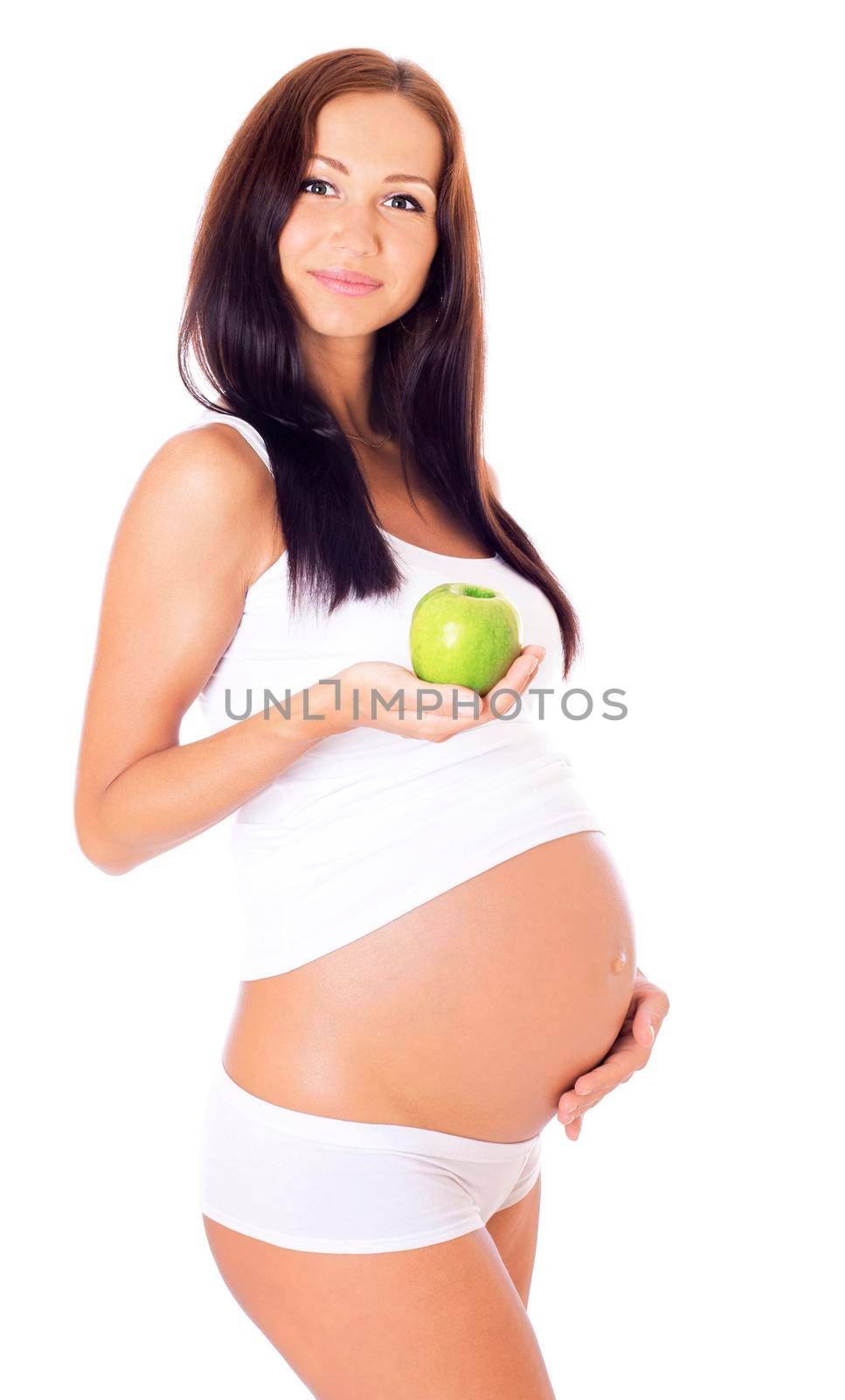 Pregnant woman holdting apple, isolated on white.