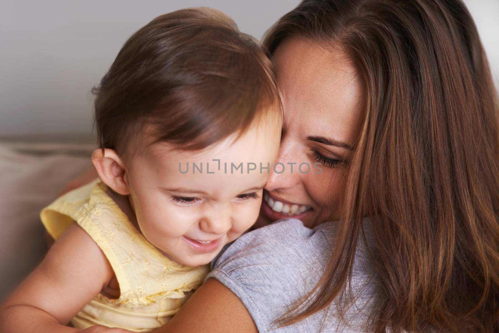 What a little bundle of love. Shot of an adorable little baby and her mother sharing a cute moment. by YuriArcurs