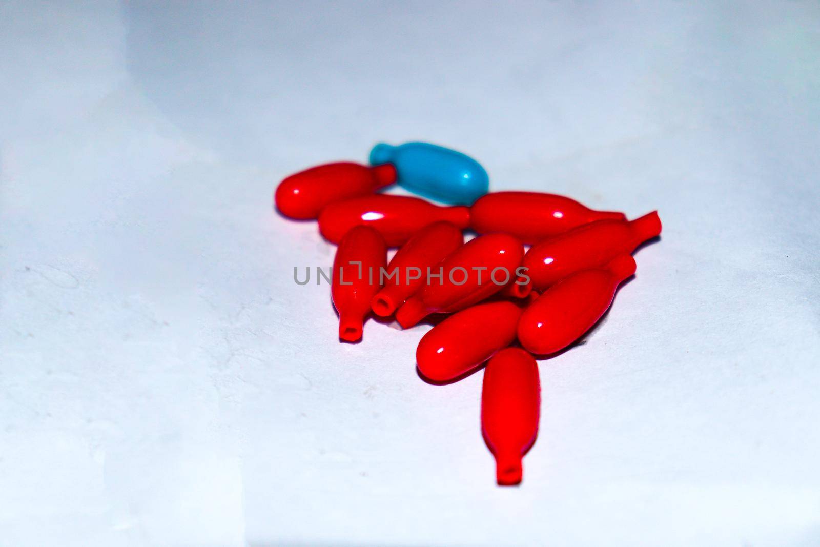 red colored vitamin a capsule stock for kid