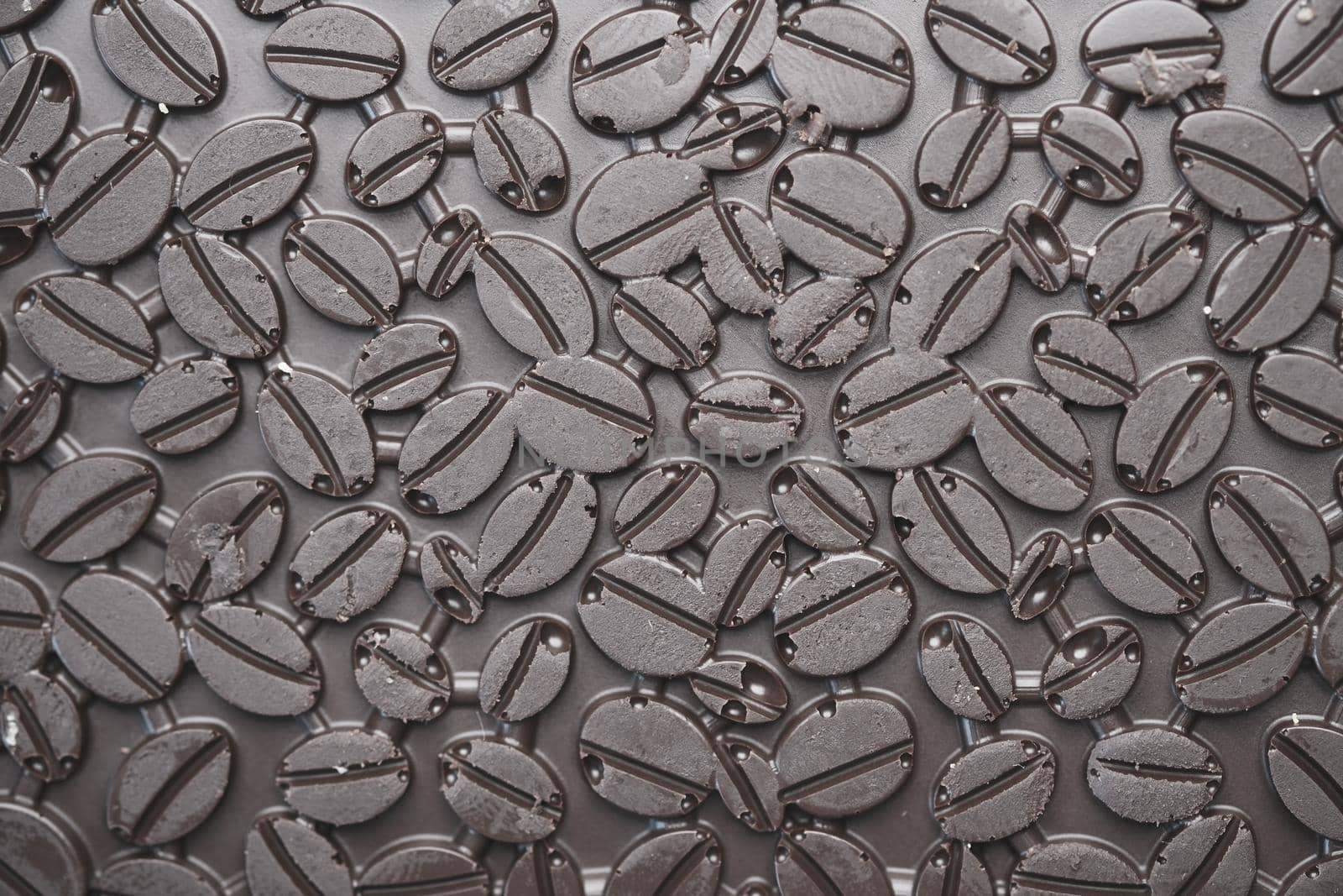 dark chocolate on a plate on table close up .
