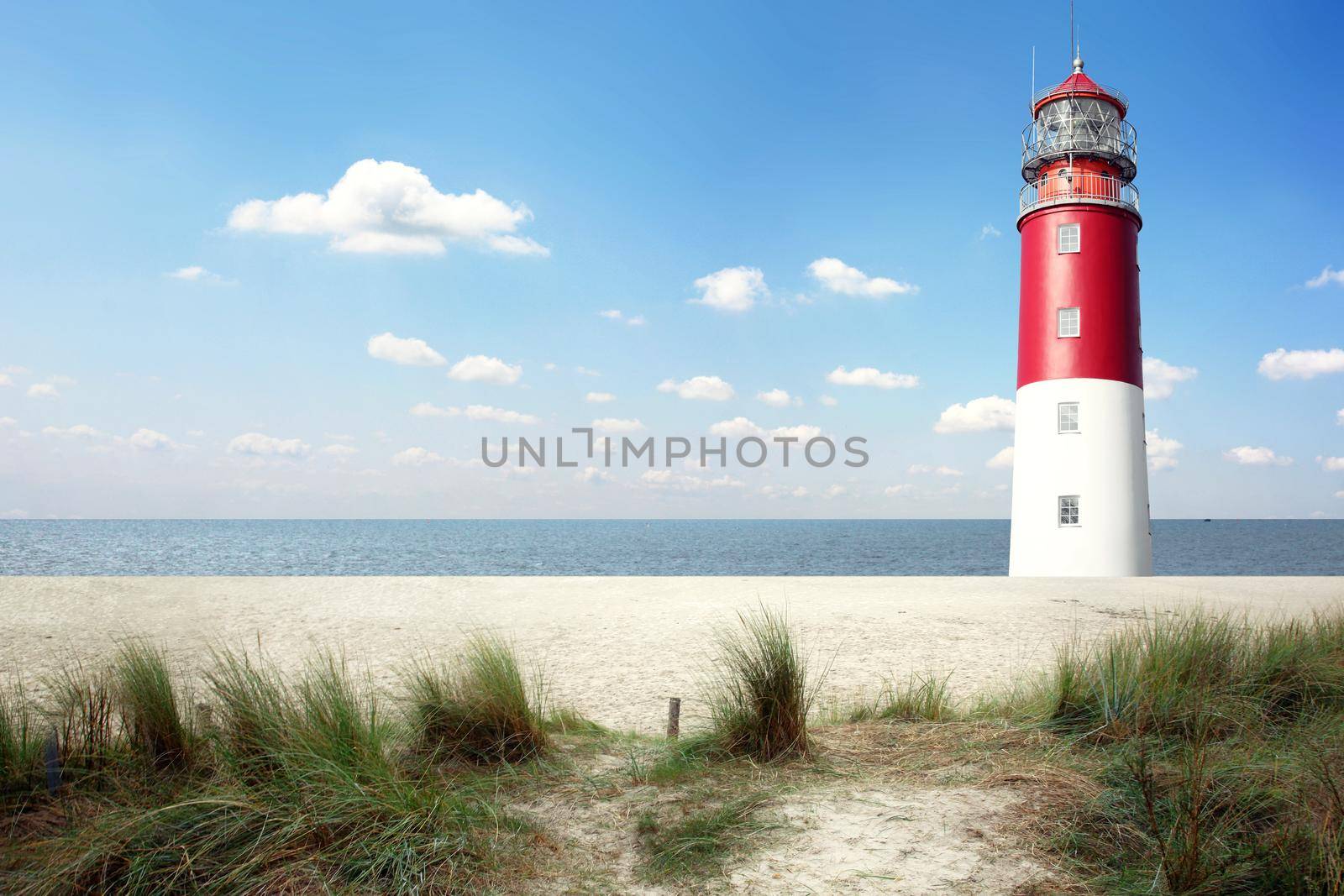 Old lighthouse searchlight beam through marine air. by Taut