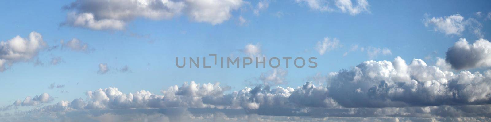 Panoramic sky with clouds on a sunny day. by Taut