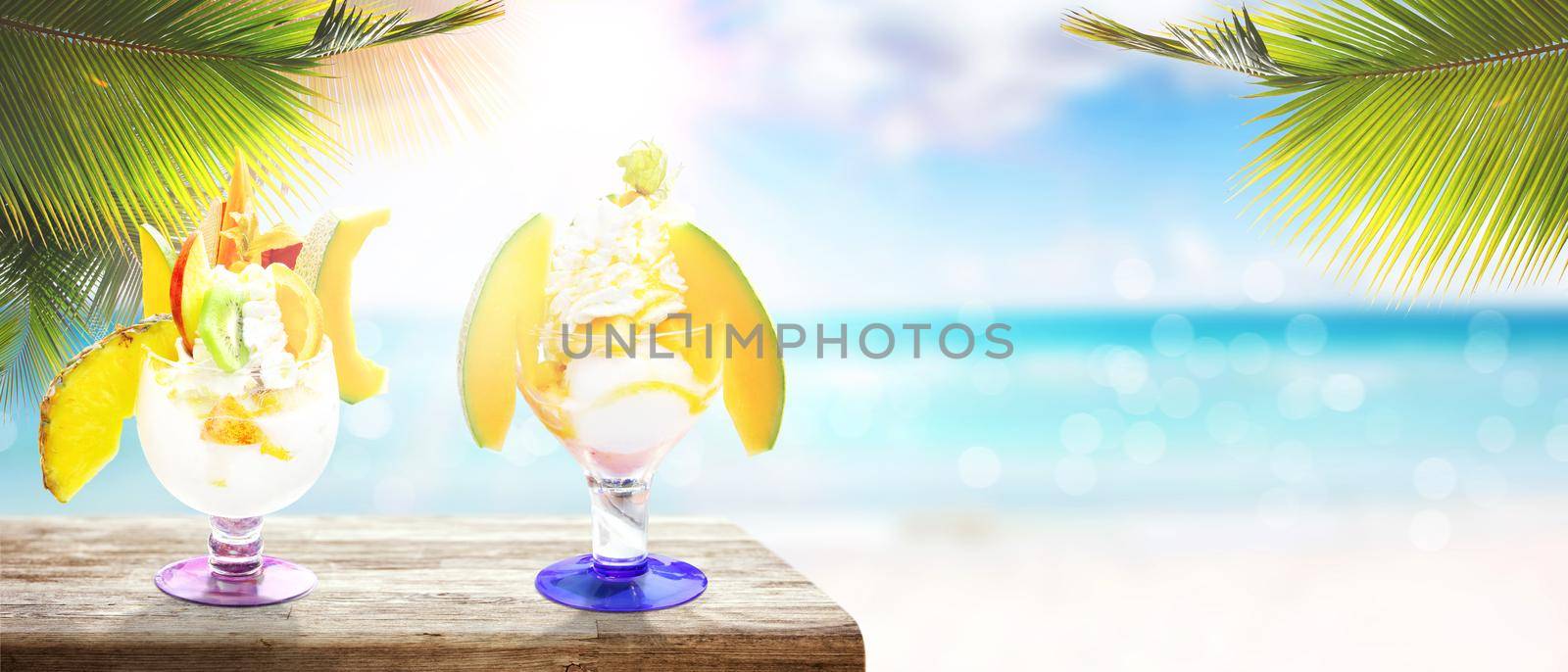 Delicious ice cream on the beach. Healthy summer food concept. by Taut