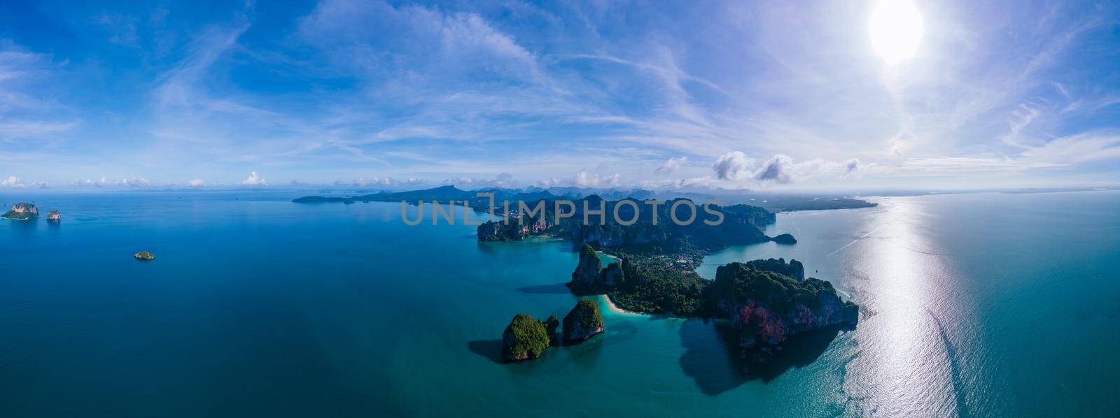 Railay beach Krabi Thailand, tropical beach of Railay Krabi, Panoramic view of idyllic Railay Beach in Thailand with a traditional long boat by fokkebok