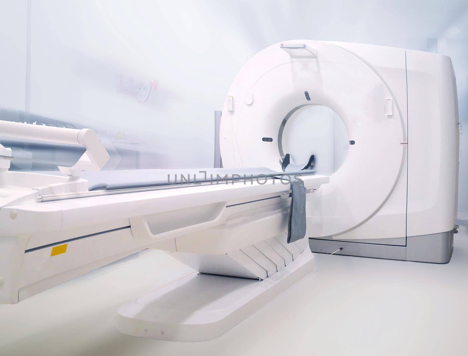 Multi detector CT Scanner ( Computed Tomography )on blurred hospital room background. by samunella