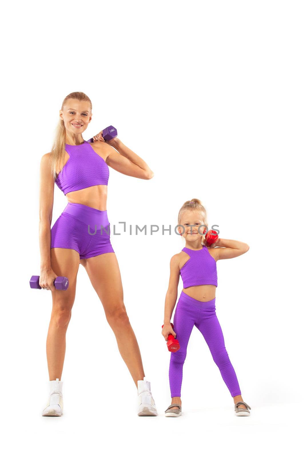 Kid doing fitness exercises at home in her room