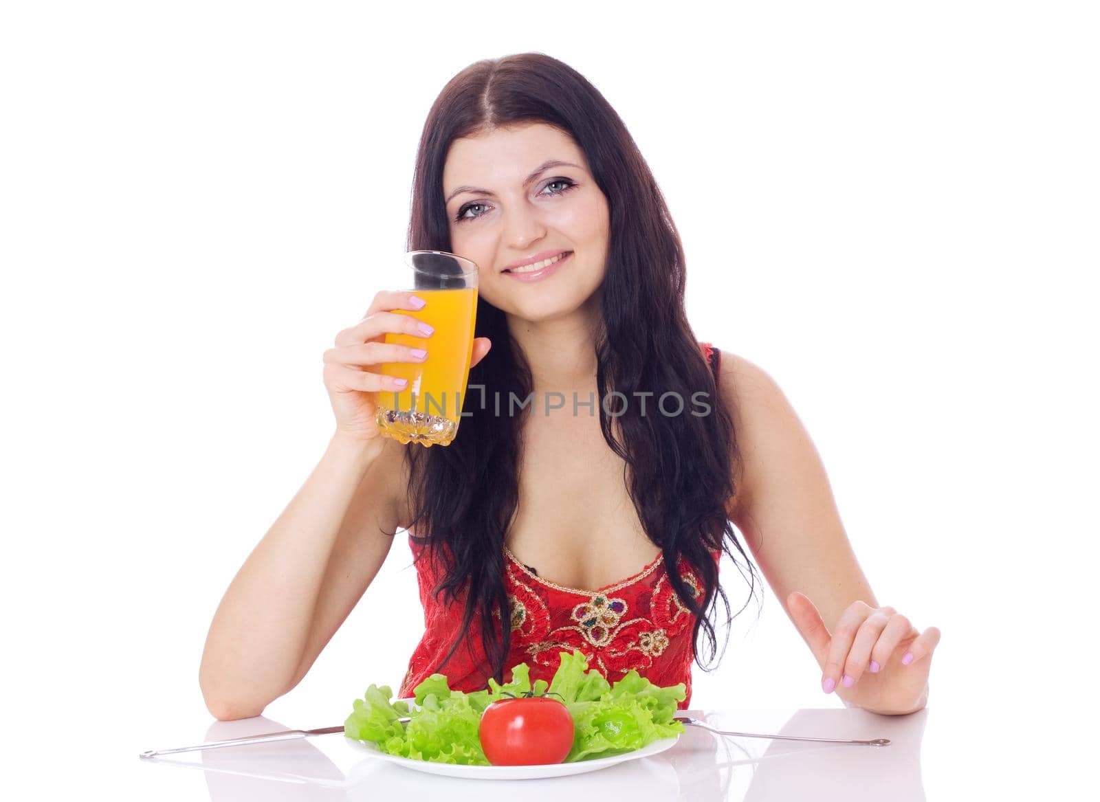 Woman with plate of salad and orange juice, isolated on white.