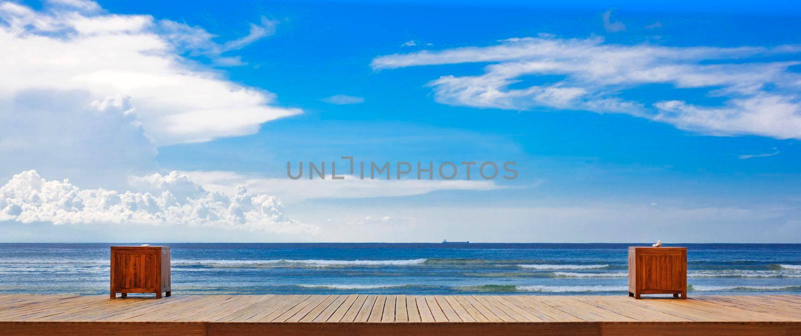 Empty wooden pier beside tropical beach. Desk space and sky background for product display montage. business presentation.