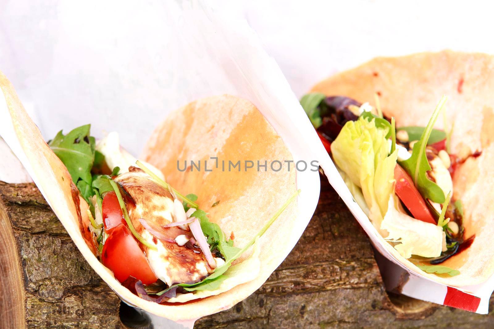 Open tortilla wrap with chicken breast and vegetables by Jyliana