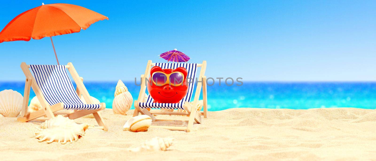 piggy bank on seashore - beach holiday background.