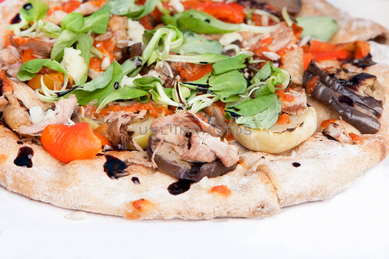 Fresh italian pizza with mushrooms, ham, tomatoes, cheese on light white background. by Jyliana