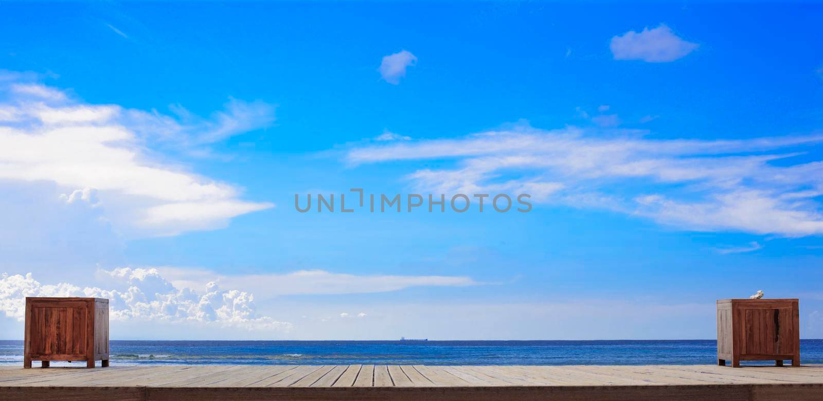 Empty wooden pier and beach. Desk space and sky background for product display montage. by Jyliana