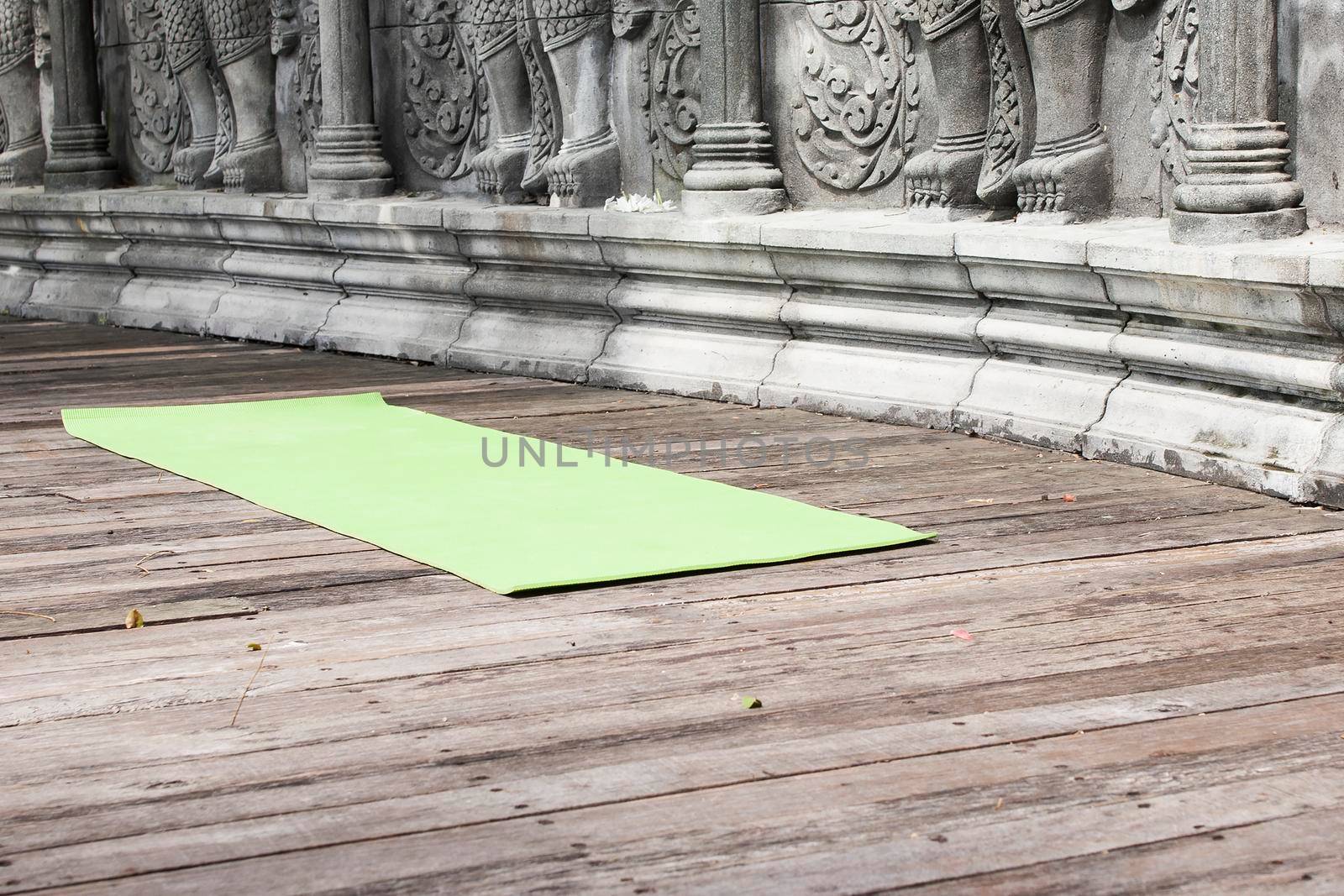 Yoga mat in abandoned temple by Jyliana