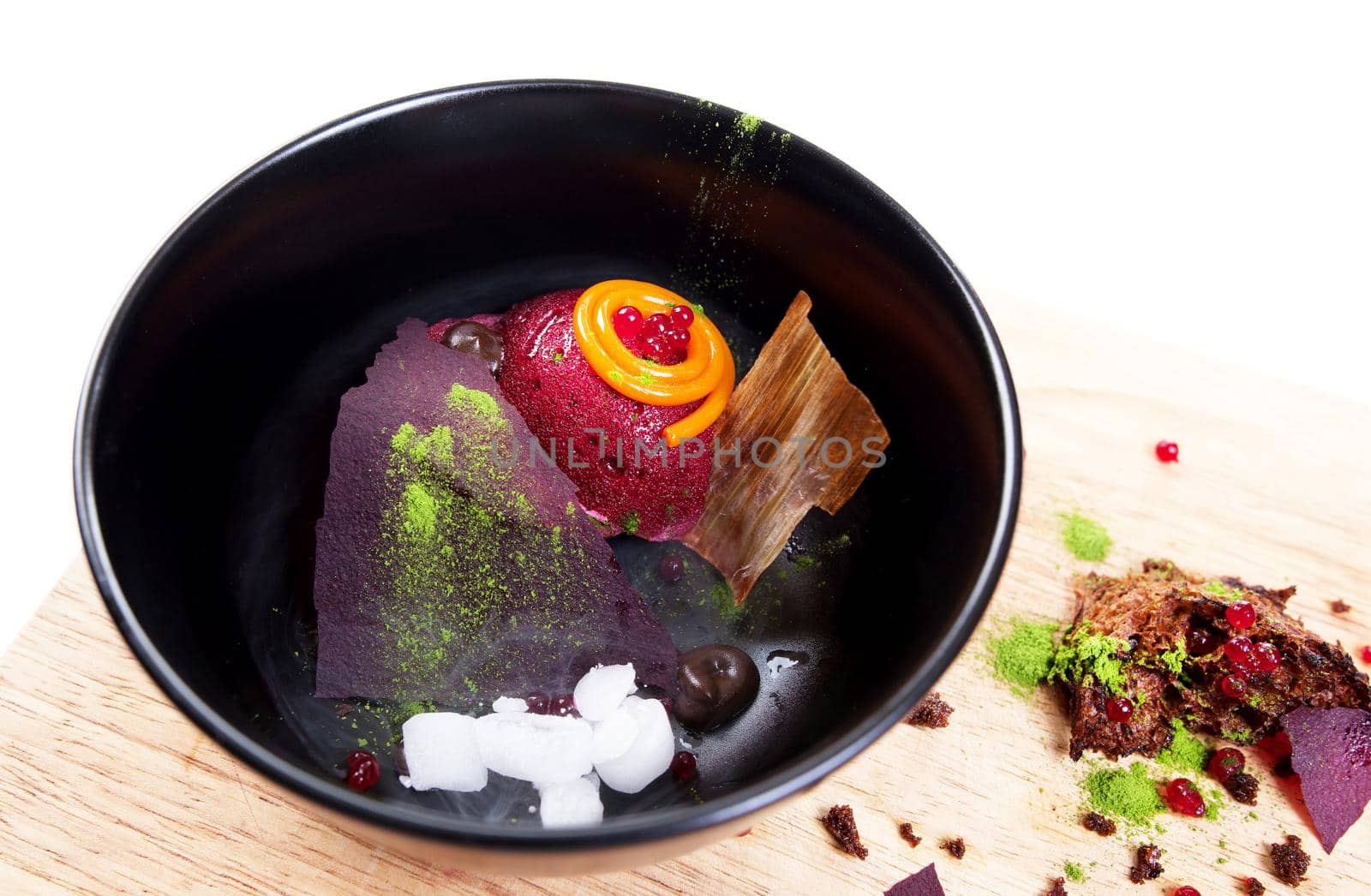 Molecular Cuisine. Delicious modern soup with beetroot. Isolated on white. Stock image.