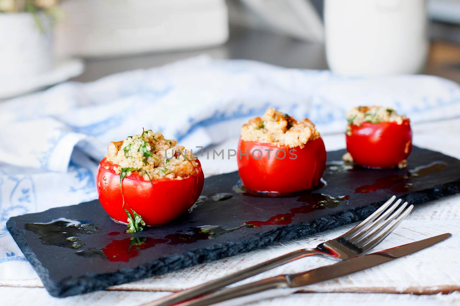 Tomato stuffed with couscous by Jyliana