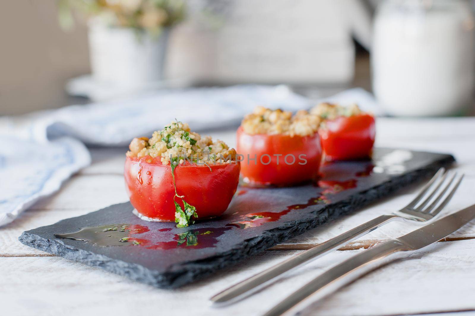 Tomato stuffed with cous cous. Vegetarian healthy food