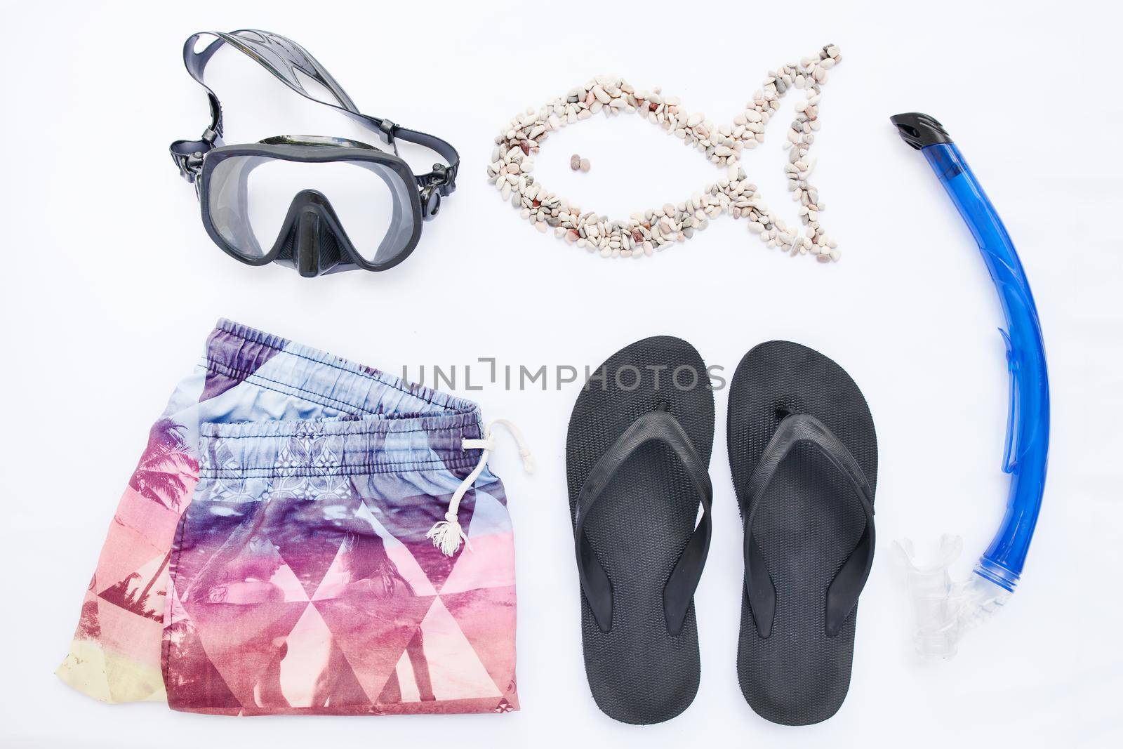 Beach accessories for snorkeling on white background. Vacation and travel, top view