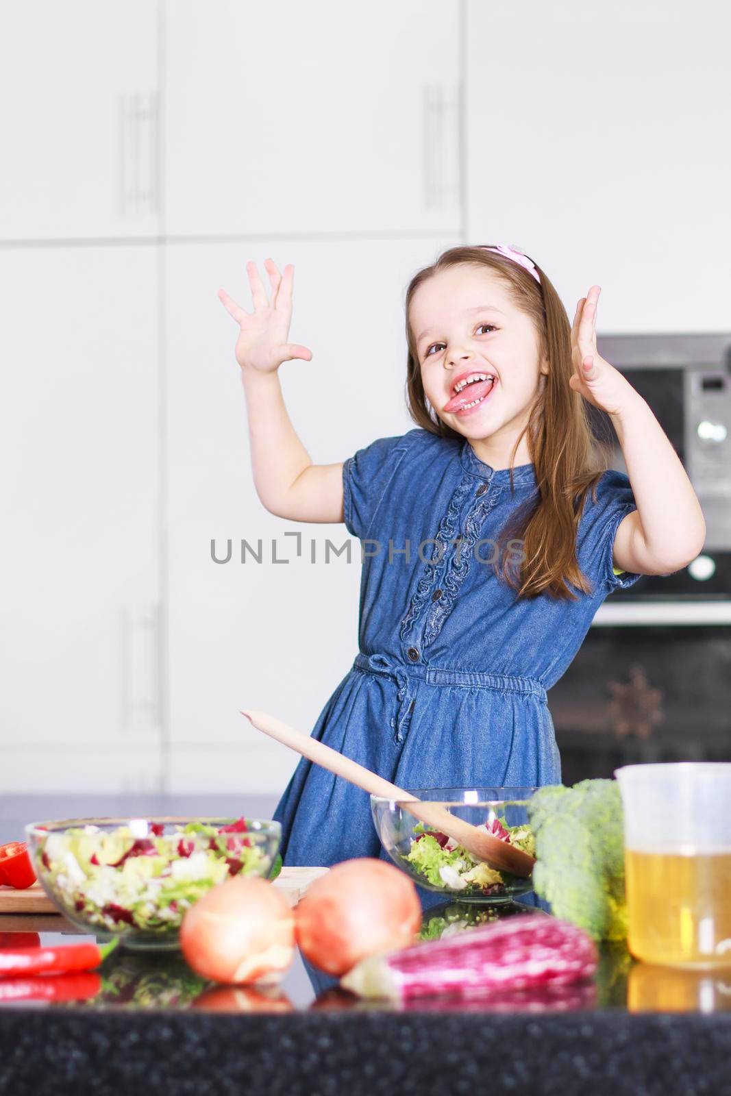 little cute girl indulges in kitchen, Family concept by Jyliana