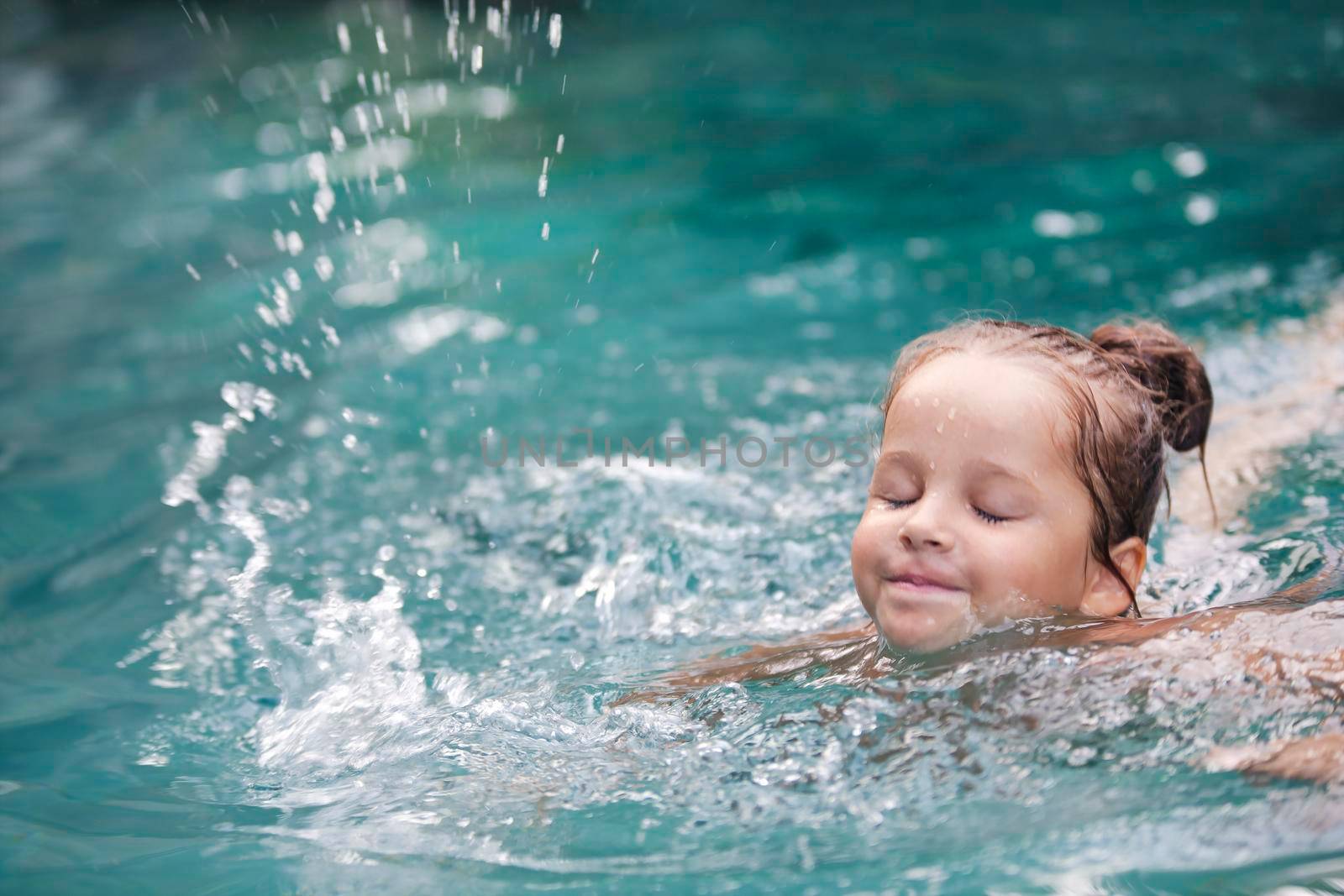 Pretty little girl in swimming pool by Jyliana